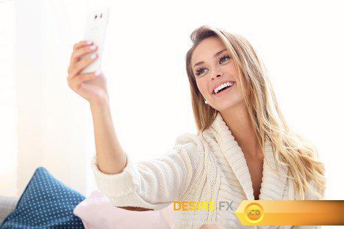 Happy woman taking selfie in bed 8X JPEG