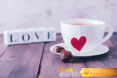 Cup of tea and chocolate candies in shape hearts 7X JPEG