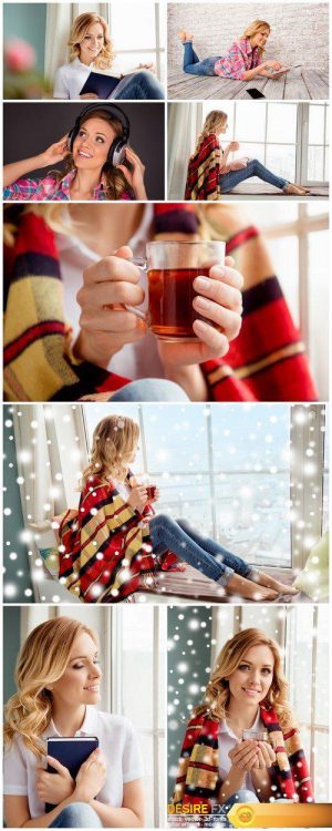 Young woman with cup of hot tea basking on xmas holidays 8X JPEG