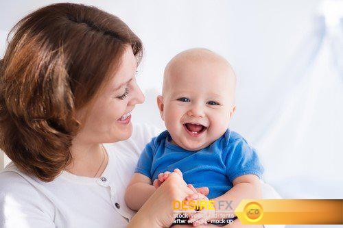 Happy young mother with baby boy at home 23X JPEG