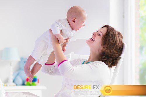 Happy young mother with baby boy at home 23X JPEG