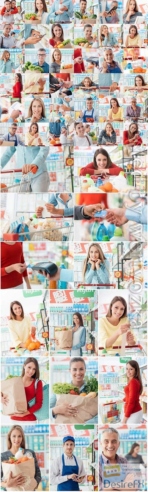 Men and women in super market shopping stock photo